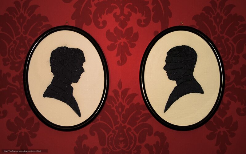 Silhouette portraits on red wallpaper