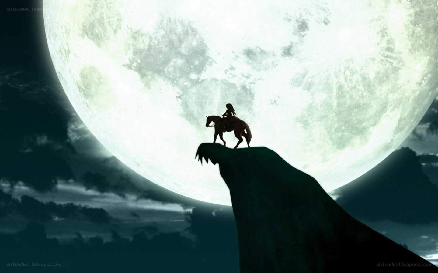 Silhouette rider on cliff