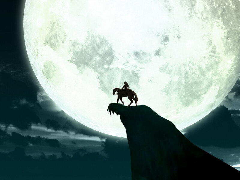 Silhouette rider on cliff