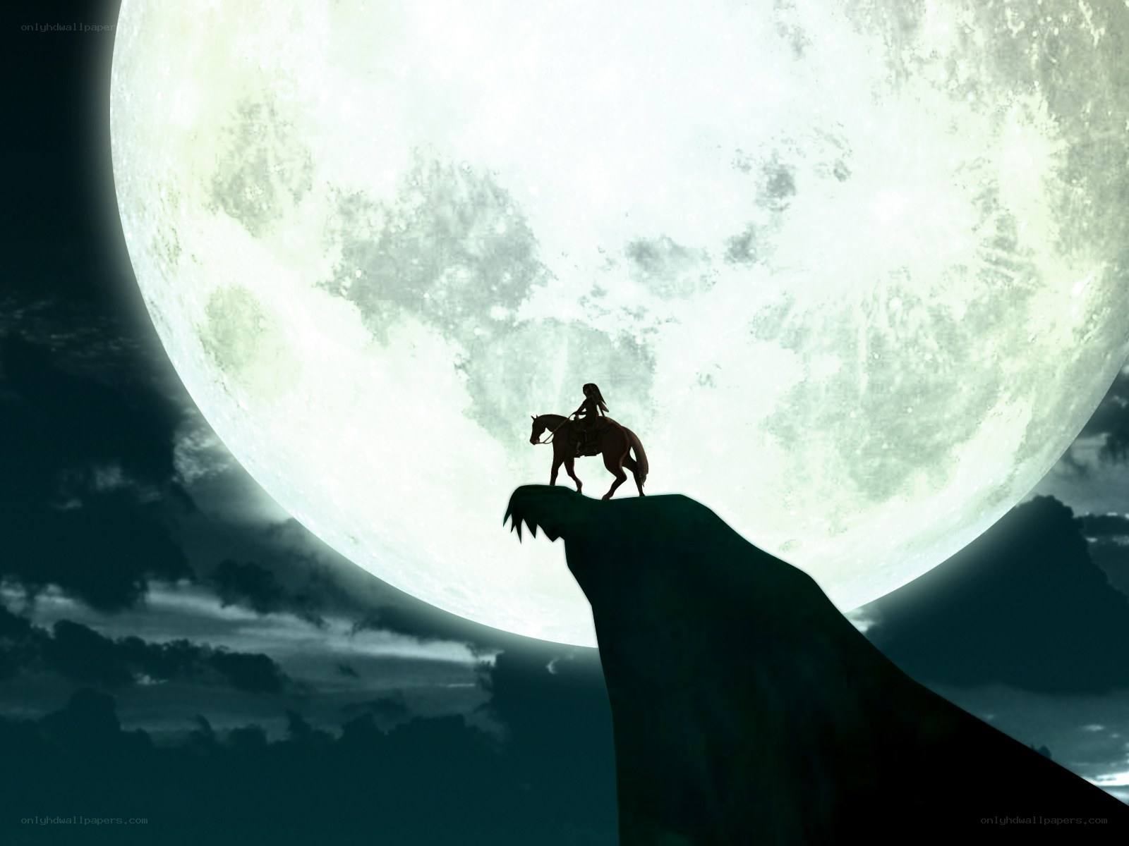 Silhouette rider on cliff