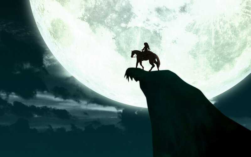 Silhouette rider on cliff