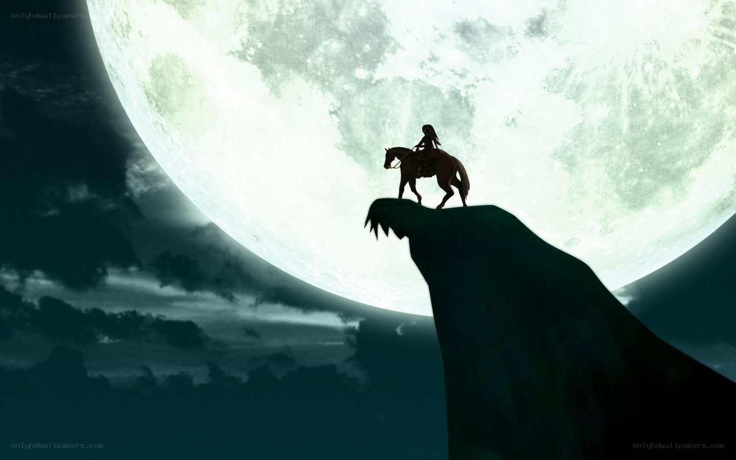 Silhouette rider on cliff