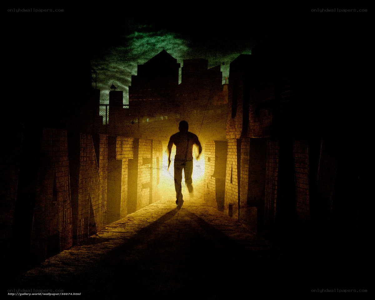 Silhouette running through alley