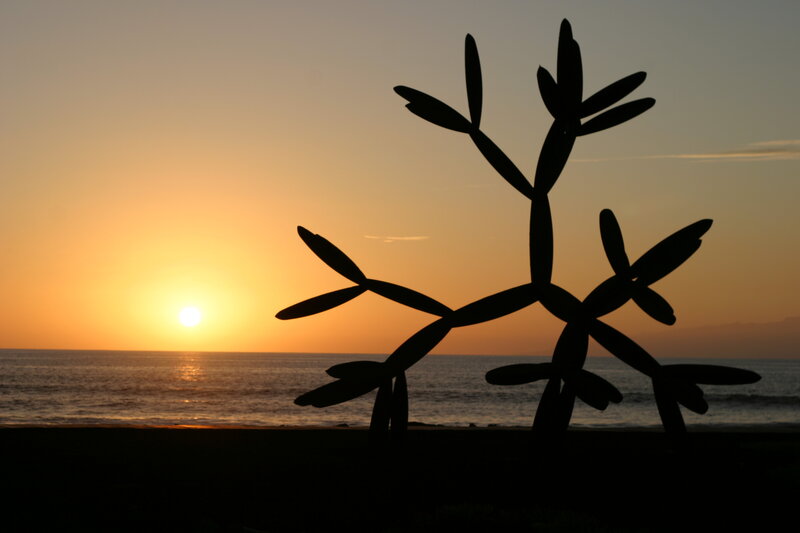 silhouette sculpture at sunset