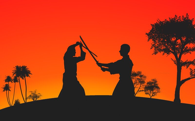 Silhouette sword fight at sunset