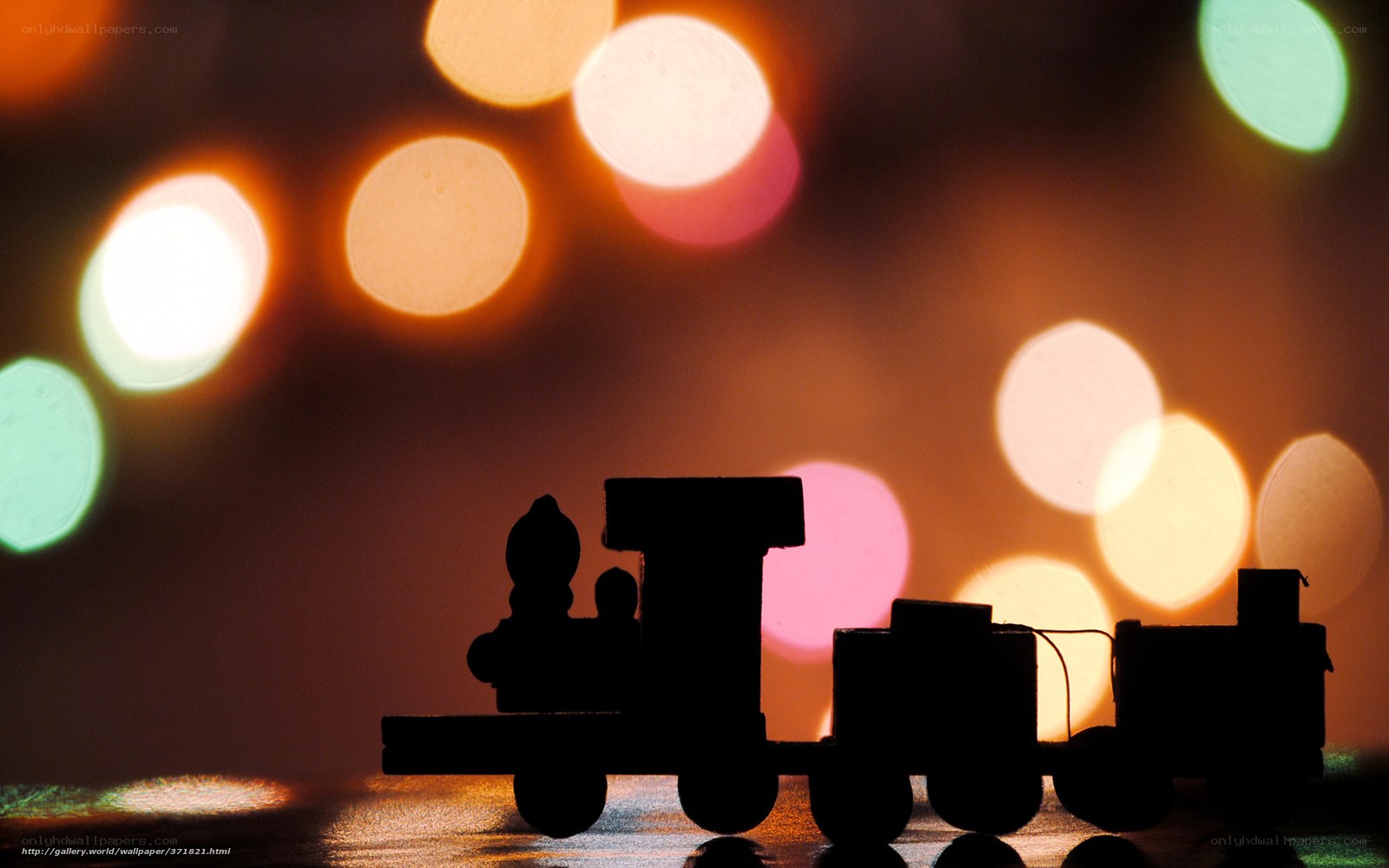 Silhouette train with bokeh lights