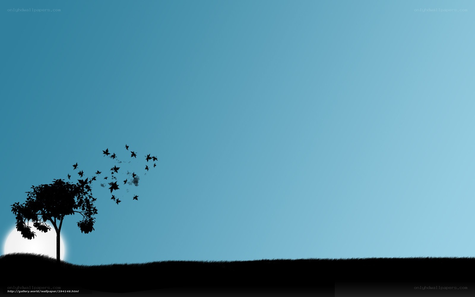 Silhouette tree with flying leaves