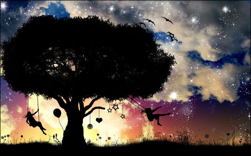 Silhouette tree with swings
