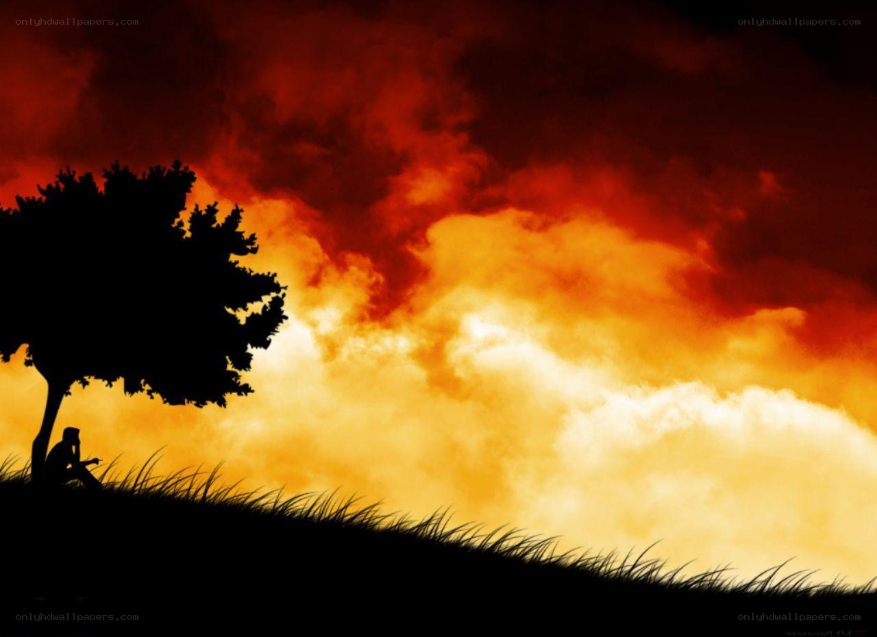 Silhouette under fiery sky