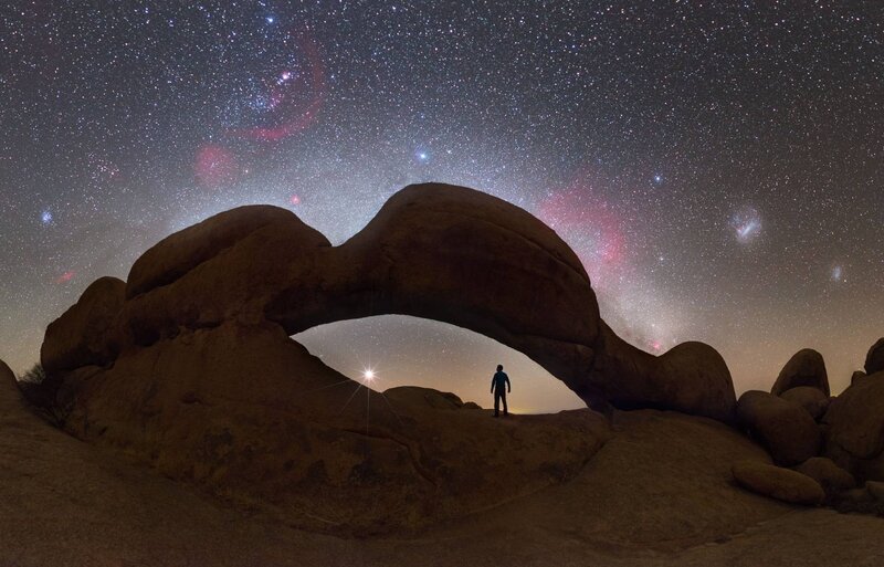 Silhouette under Rock Arch