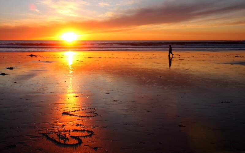 Silhouette Walking on Beach