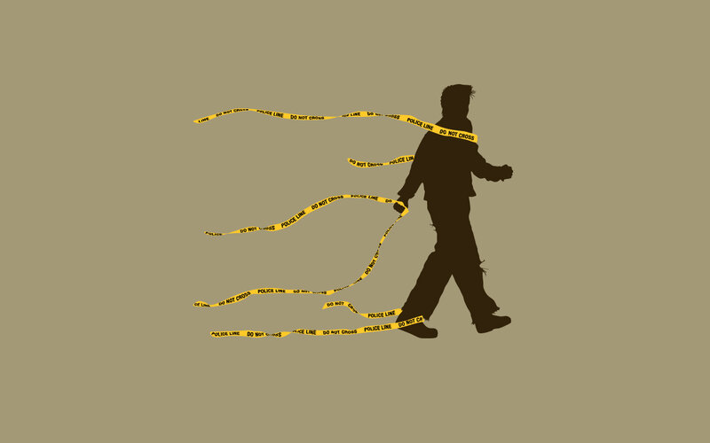 silhouette walking through police tape