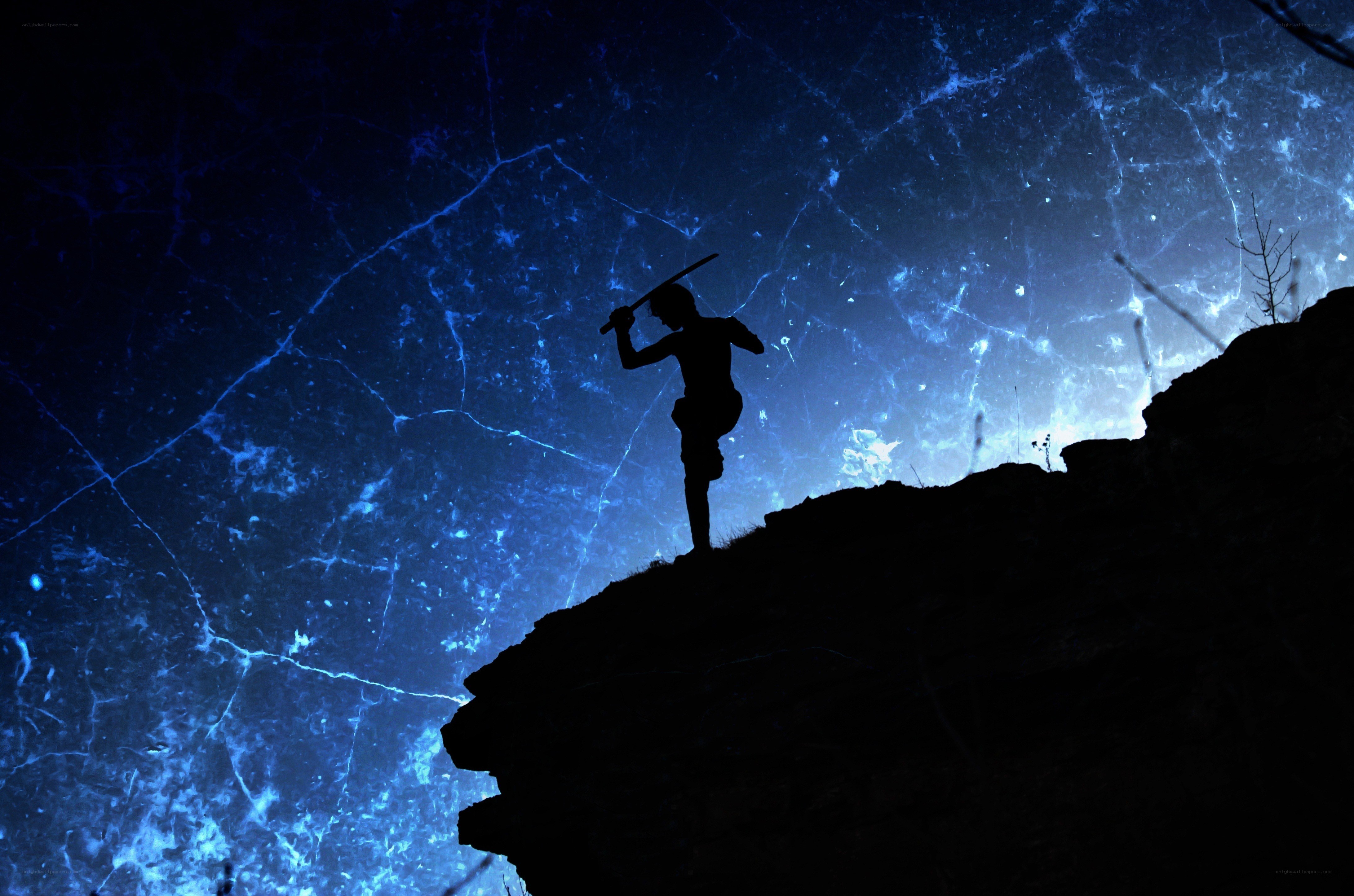 Silhouette warrior on cliff