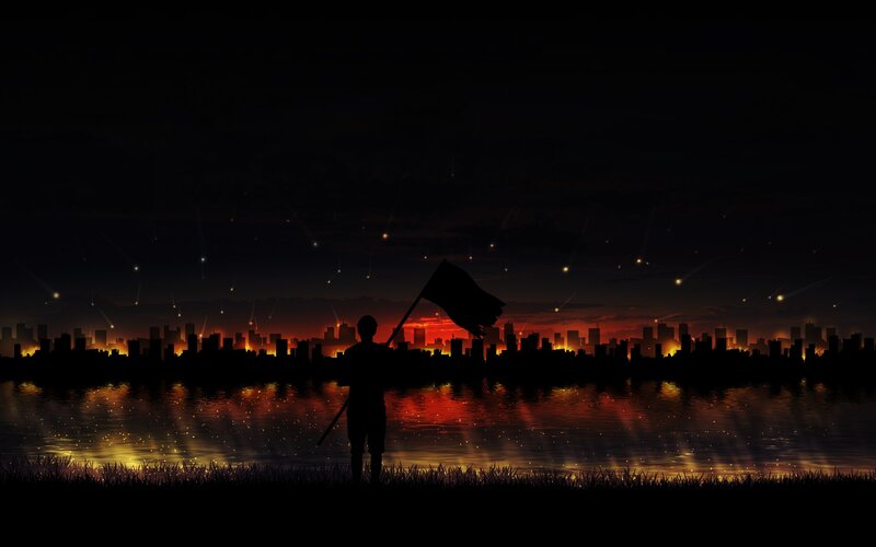 Silhouette with flag at sunset