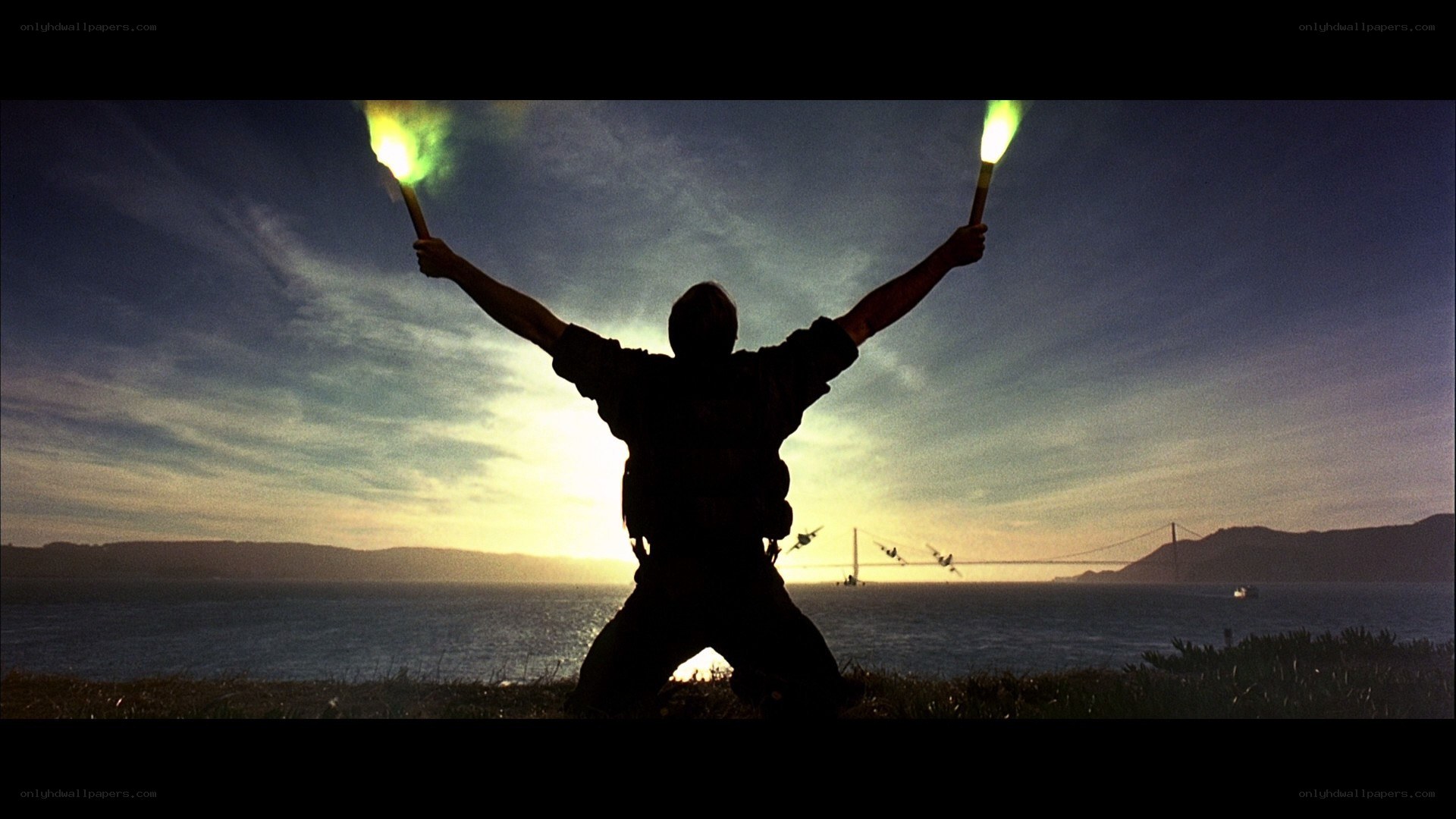 Silhouette with flares at sunset