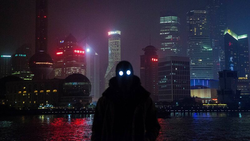 Silhouette with glowing eyes at night