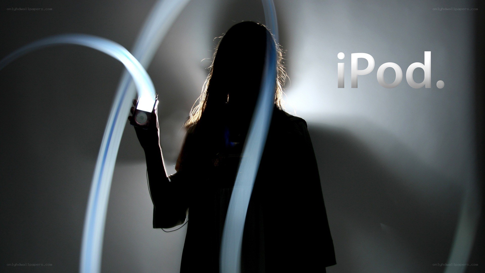 Silhouette with iPod and light trails