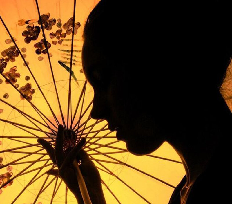 silhouette with paper umbrella