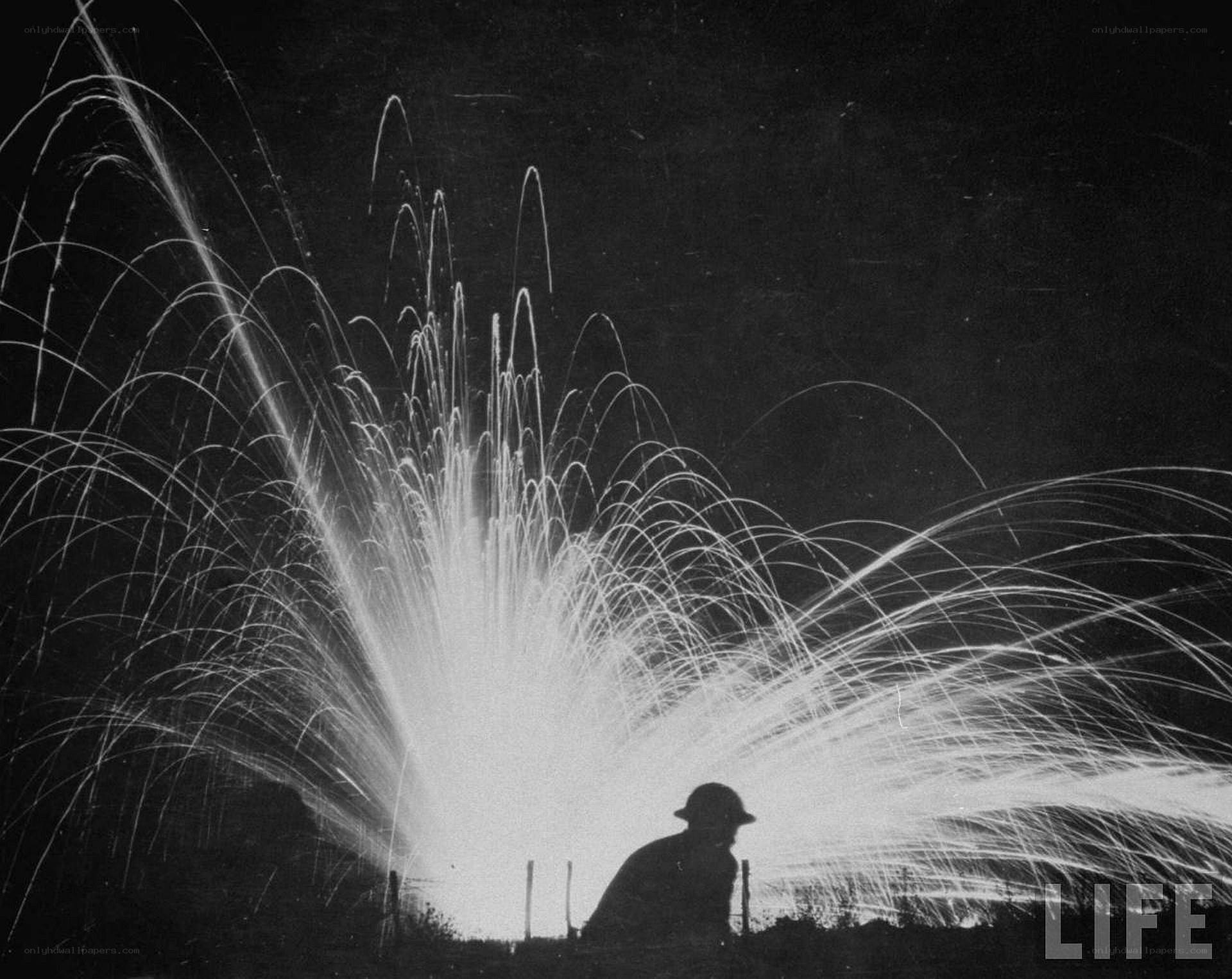 Silhouette with sparkler at night