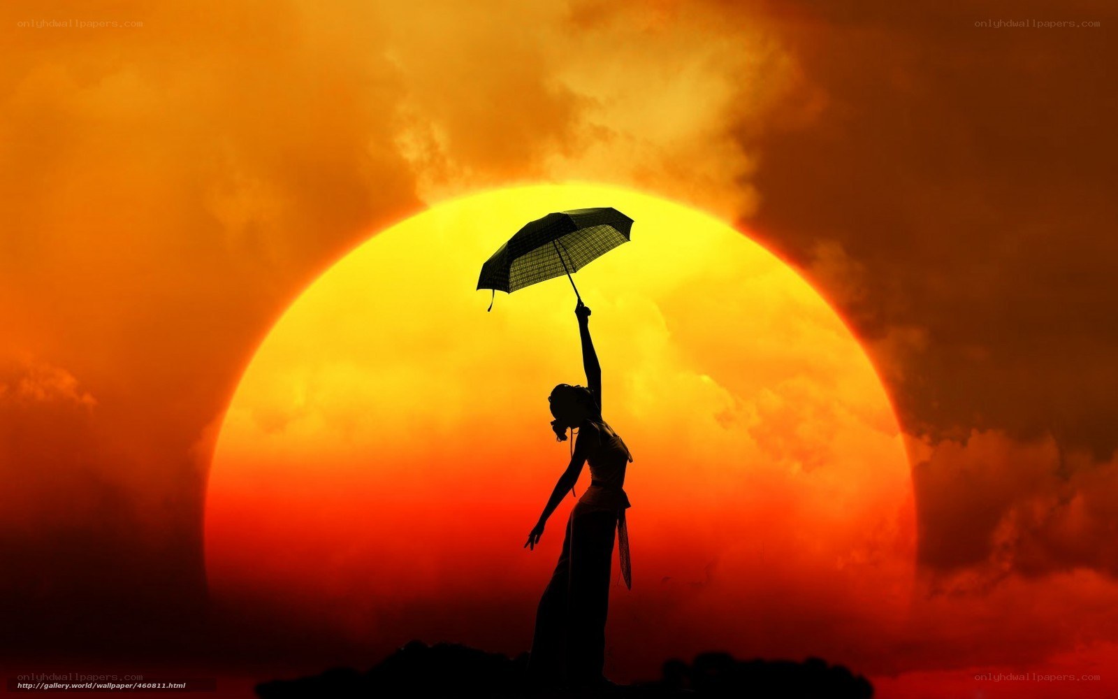 Silhouette with umbrella at sunset