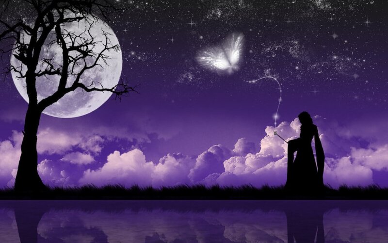 Silhouette with wand under moonlight