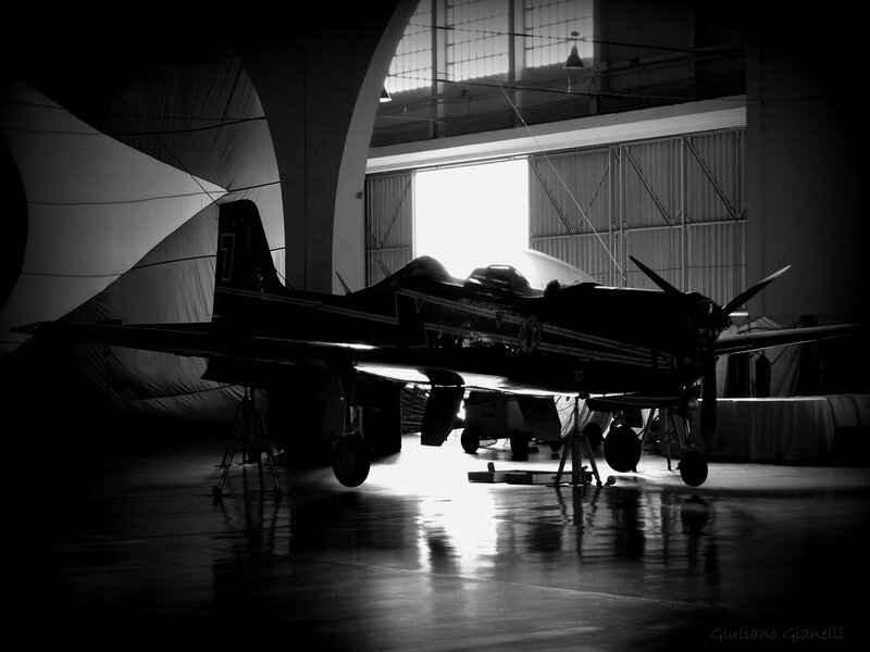 Silhouetted Airplane in Hangar