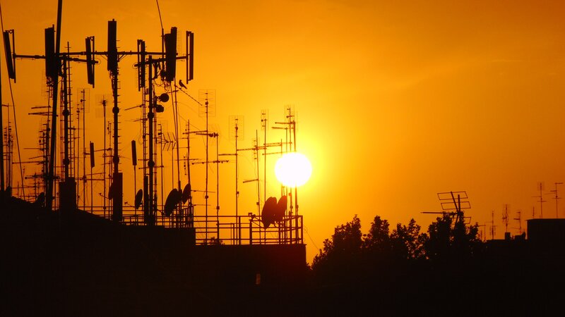 Silhouetted Antennas at Sunset
