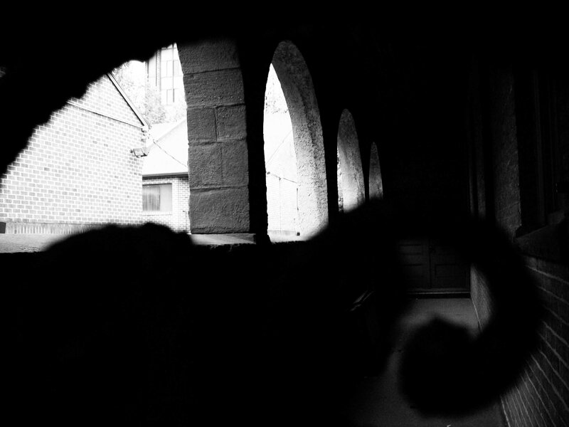 Silhouetted Arches and Brick Wall