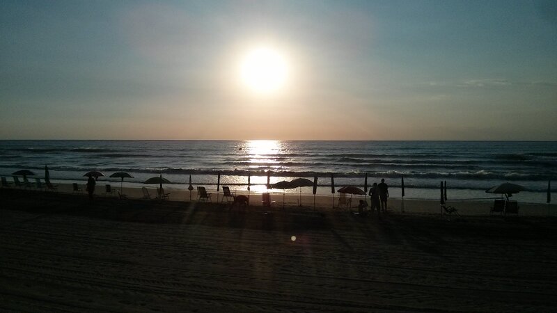 Silhouetted Beachgoers