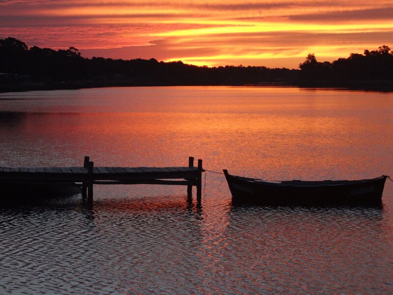 Silhouetted Boat and Dock