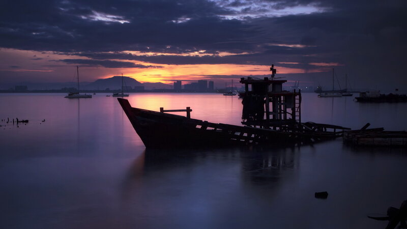 Silhouetted Boat at Dusk — Purple
