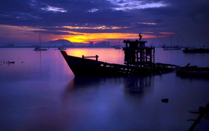 Silhouetted Boat at Dusk