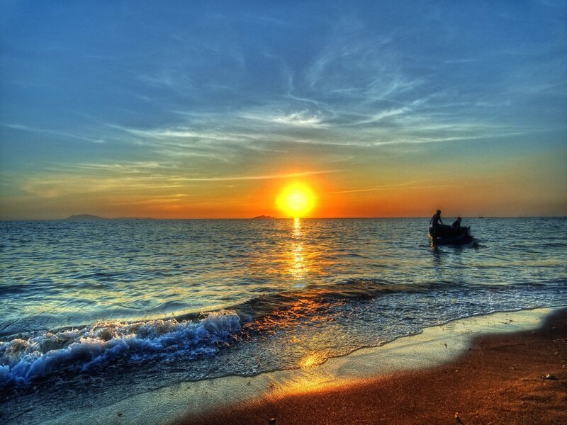 Silhouetted Boat at Sunset — Blue, Serene