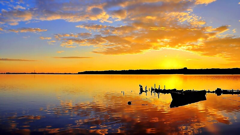Silhouetted Boat at Sunset — Orange, Serene, Photograph, Dock