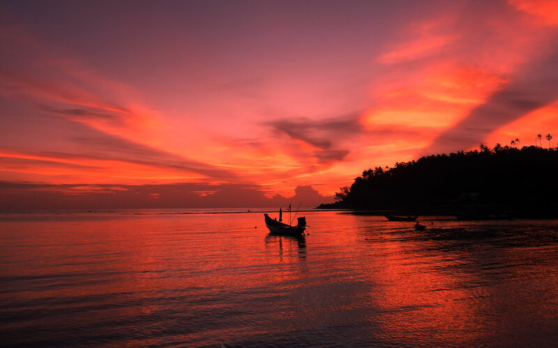 Silhouetted Boat at Sunset — Red