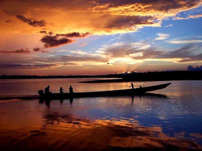 Silhouetted Boat on River — Orange