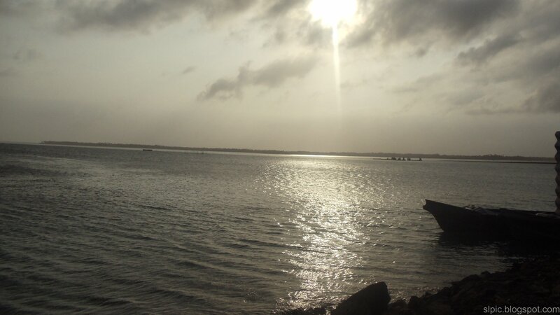 Silhouetted Boat on Water — Gray, Serene, Sunset