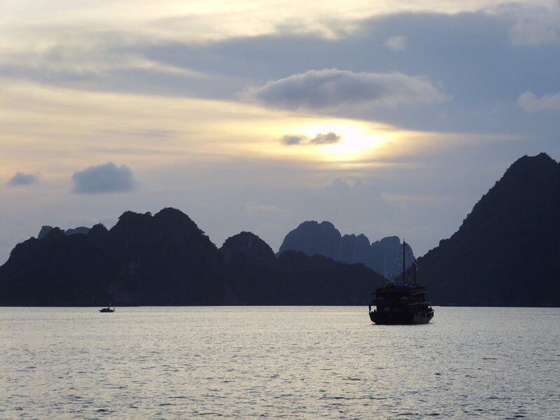 Silhouetted Boats at Sea — Blue
