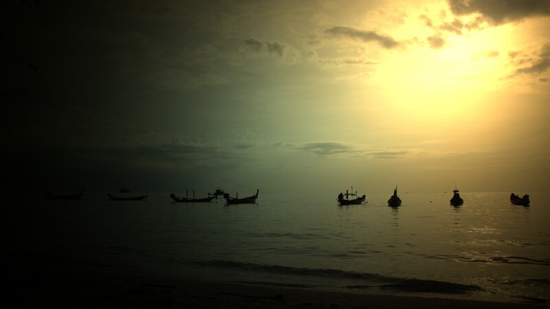 Silhouetted Boats at Sea — Yellow