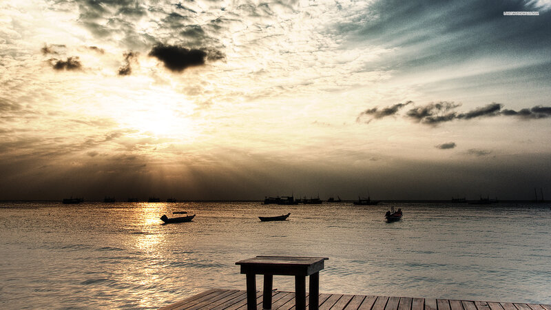 Silhouetted Boats at Sunset — Gold, Dramatic