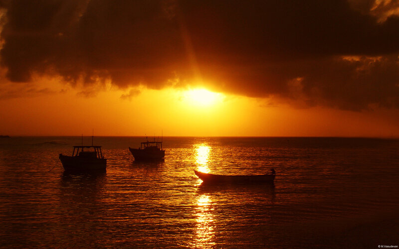 Silhouetted Boats at Sunset — Orange, Dramatic, Photograph