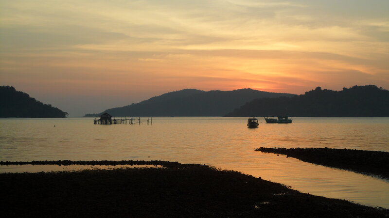 Silhouetted Boats at Sunset — Orange, Serene