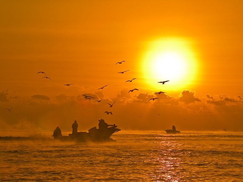 Silhouetted Boats at Sunset — Orange