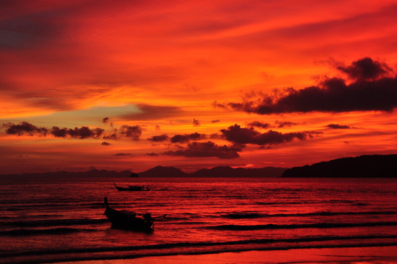 Silhouetted Boats at Sunset — Red, Dramatic