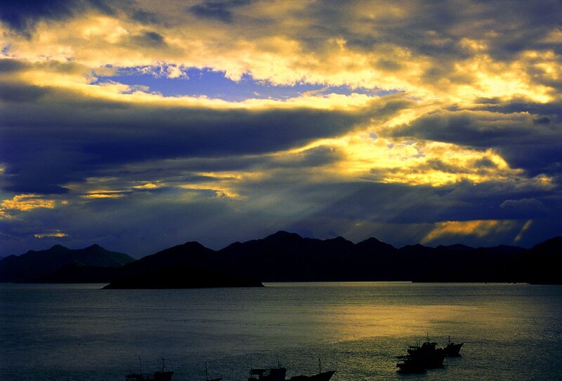 Silhouetted Boats at Sunset — Yellow, Dramatic
