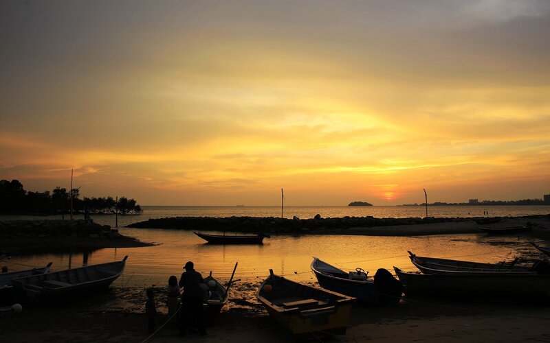 Silhouetted Boats at Sunset — Yellow, Serene, Photograph, People