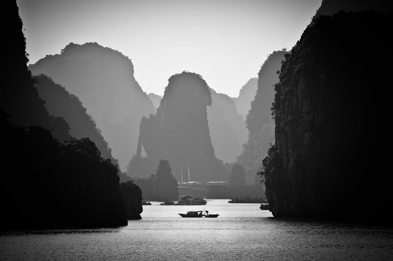 Silhouetted Boats in Bay