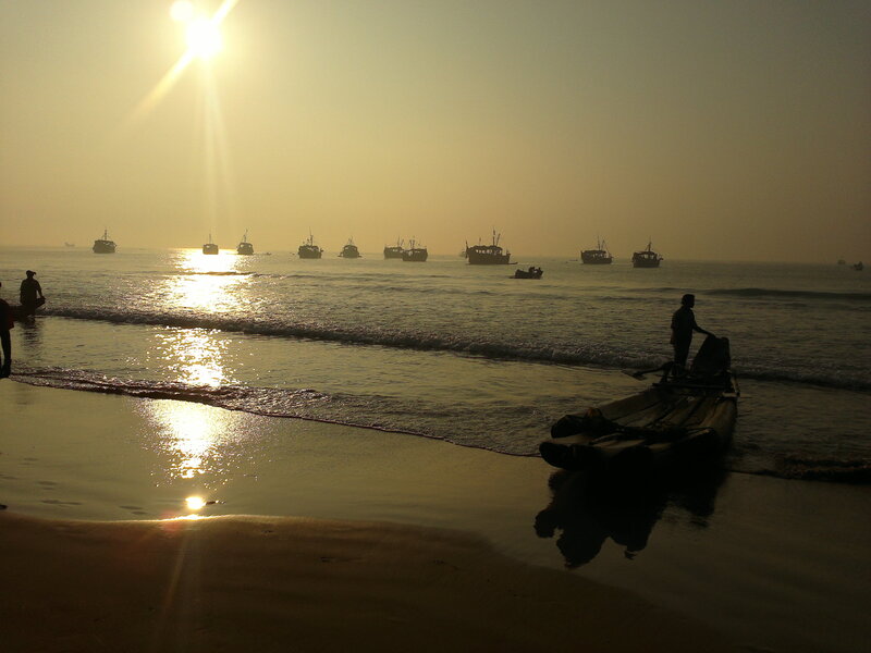 Silhouetted Boats on Beach
