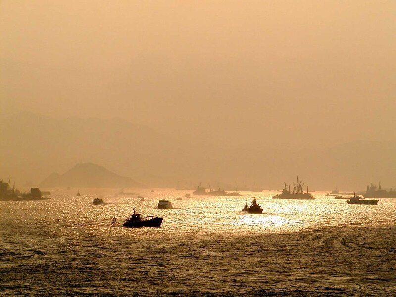 Silhouetted Boats on Water — Gold