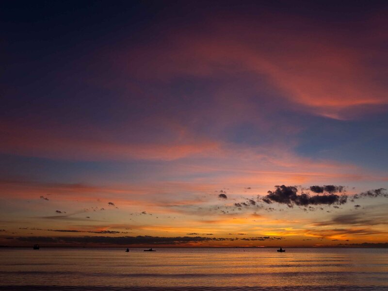 Silhouetted Boats on Water — Orange, Serene, Sunset